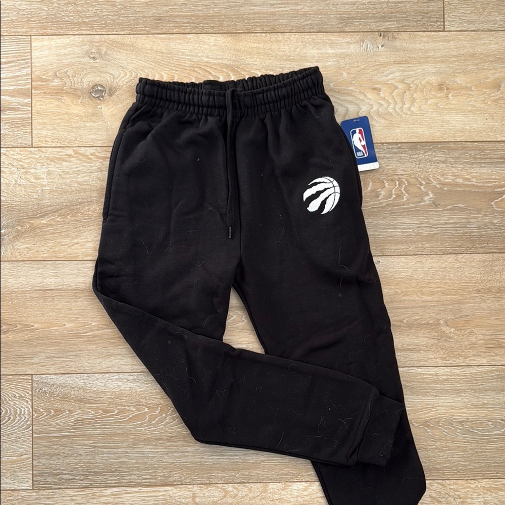 BNWT black jogging pants with Raptor’s logo (NBA brand), youth size large